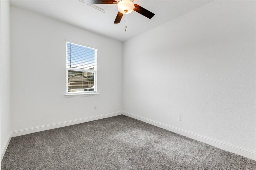 1433 Arciones Road Fort Worth, TX 76052 - Photo 11 of 33 an empty room with a window
