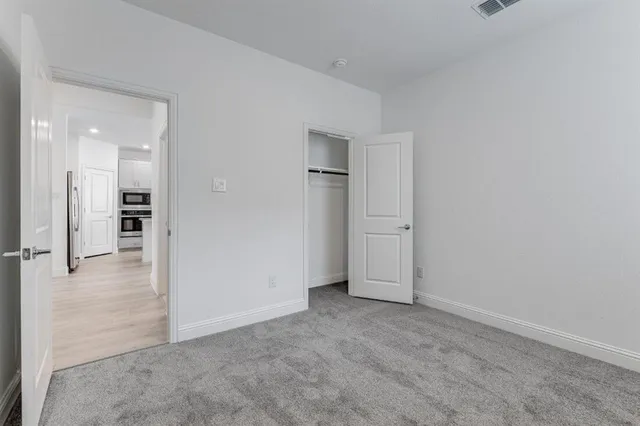 a white bath tub sitting next to a white toilet