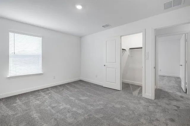 an empty room with ceiling fan and ceiling fan