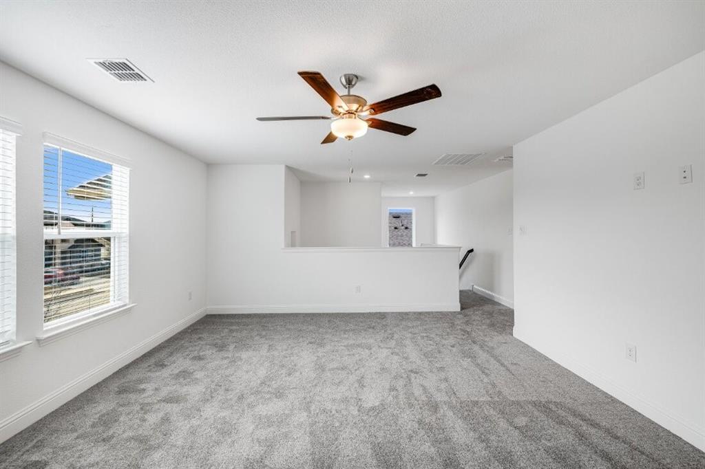1433 Arciones Road Fort Worth, TX 76052 - Photo 22 of 33 a view of an empty room with a window