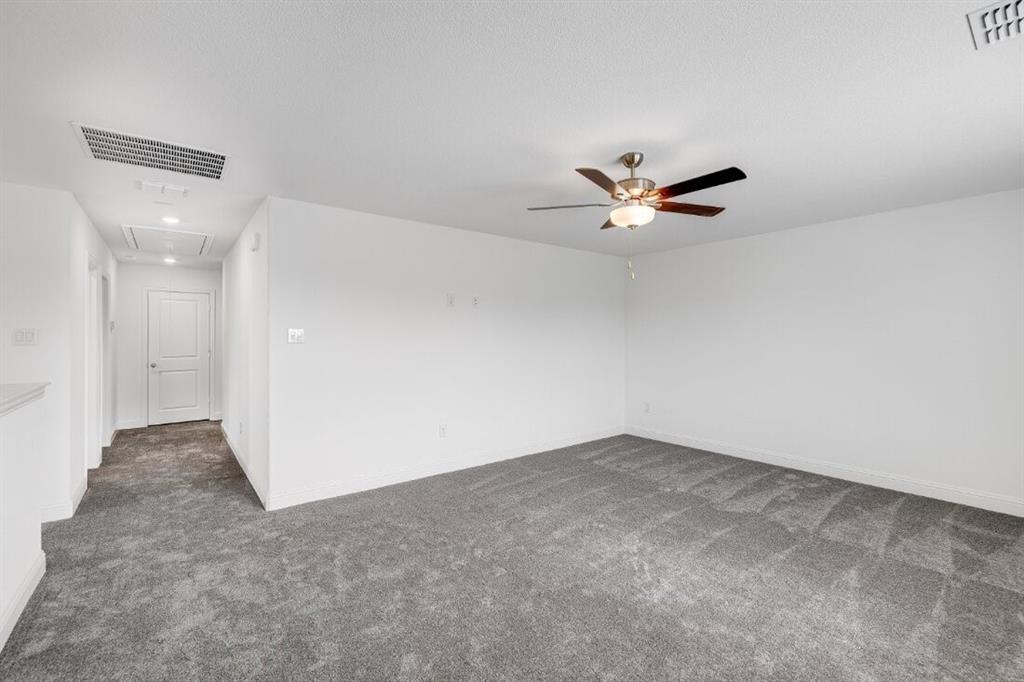 1433 Arciones Road Fort Worth, TX 76052 - Photo 23 of 33 an empty room with ceiling fan and ceiling fan