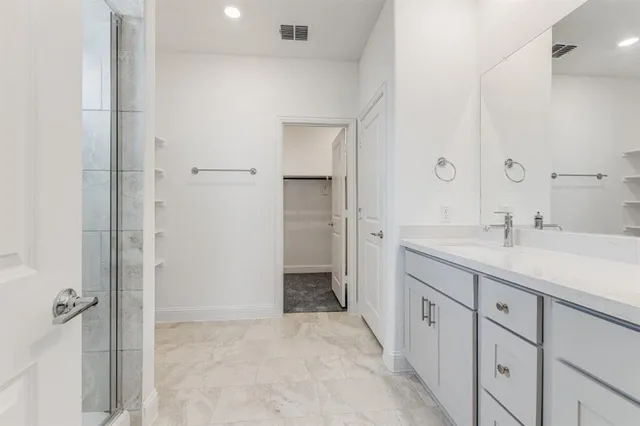 a kitchen with granite countertop a stove and a sink