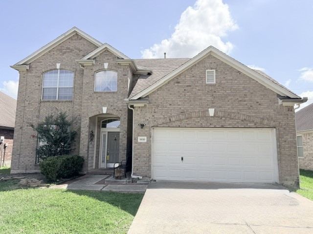 20030 Castlegreen Drive Spring, TX 77388 - Photo 1 of 23 a front view of a house with garden