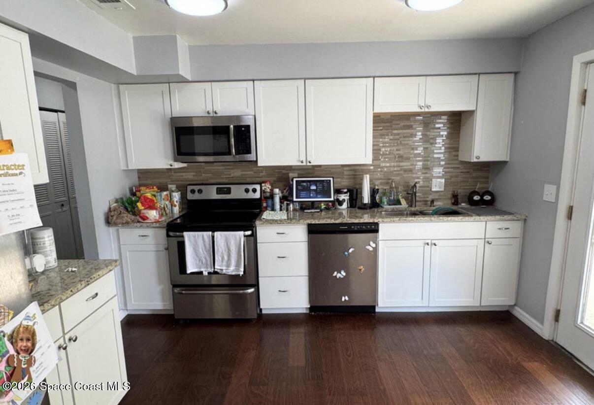 938 Brunswick Lane Rockledge, FL 32955 - Photo 14 of 21 Looking into kitchen from dining room