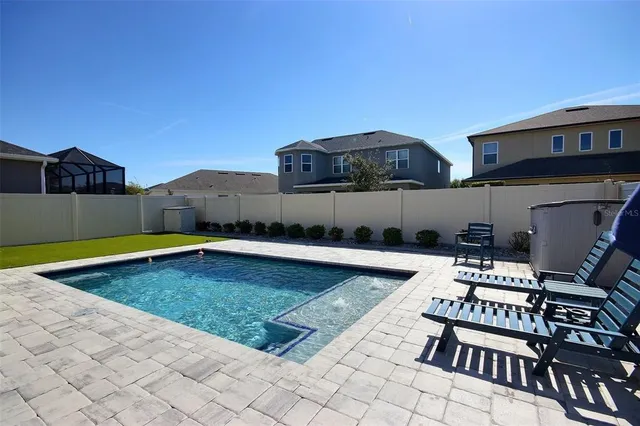 a view of a bathroom with a sink and a washer dryer