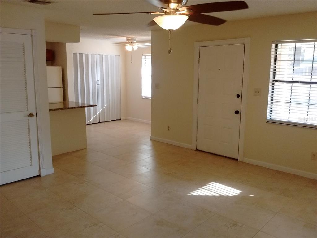 457 Hemlock Street Altamonte Springs, FL 32714 - Photo 9 of 15 an empty room with chandelier fan