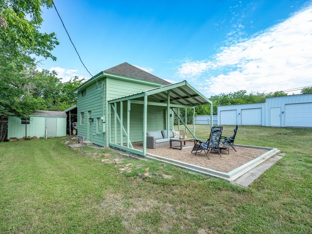907 4th Street Graham, TX 76450 - Photo 28 of 34 a backyard of a house with table and chairs