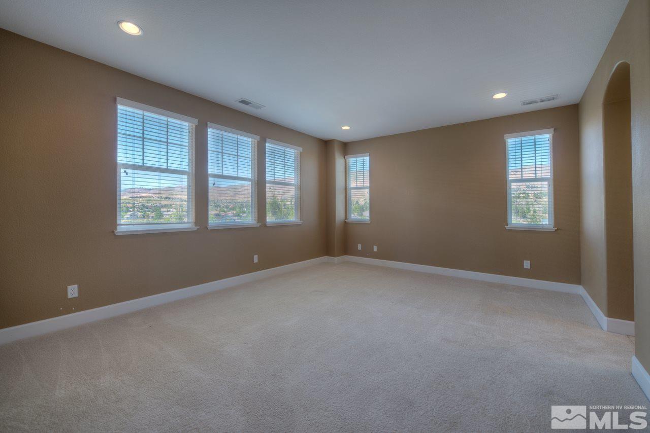7781 Shalestone Way Reno, NV 89523 - Photo 13 of 24 a view of an empty room with a window
