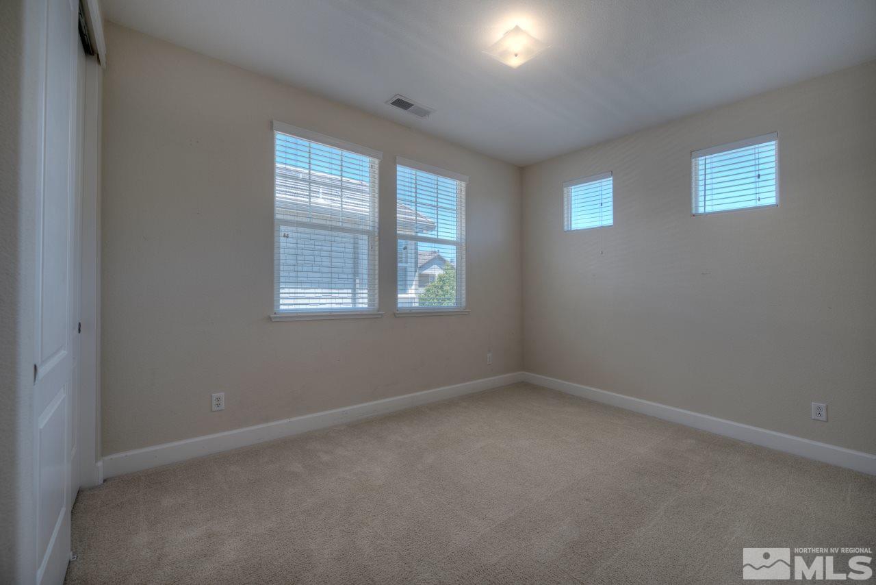 7781 Shalestone Way Reno, NV 89523 - Photo 15 of 24 an empty room with windows