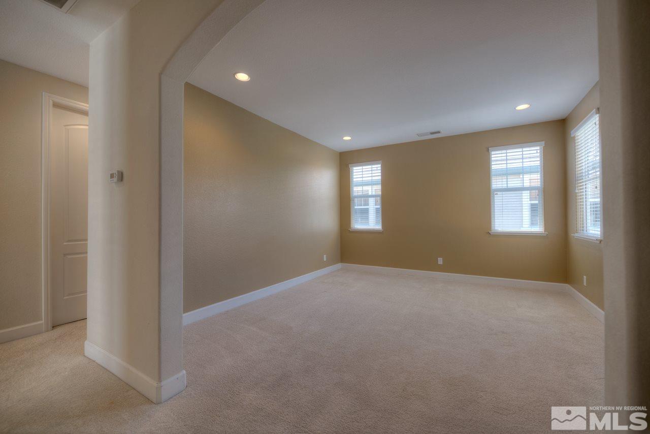 7781 Shalestone Way Reno, NV 89523 - Photo 8 of 24 a view of an empty room with a window