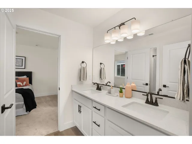 a bathroom with a sink vanity and mirror