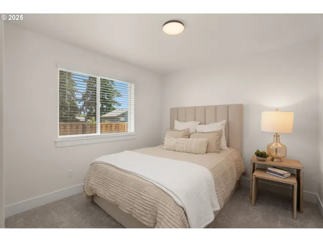 a bedroom with a bed and window