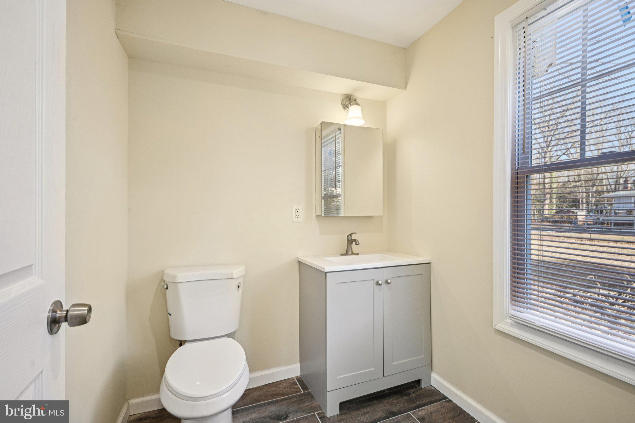 195 Chews Landing Road Clementon, NJ 08021 - Photo 27 of 48 a bathroom with a toilet a sink and mirror