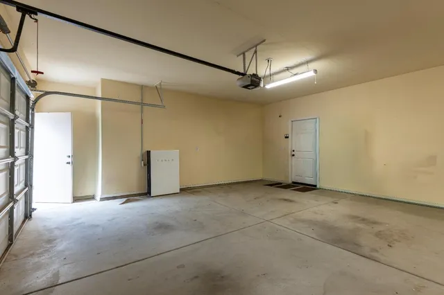 a view of a garage with parked cars