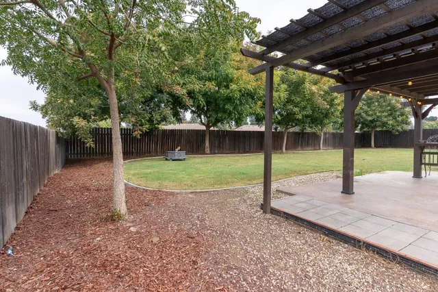 a backyard of a house with lots of green space