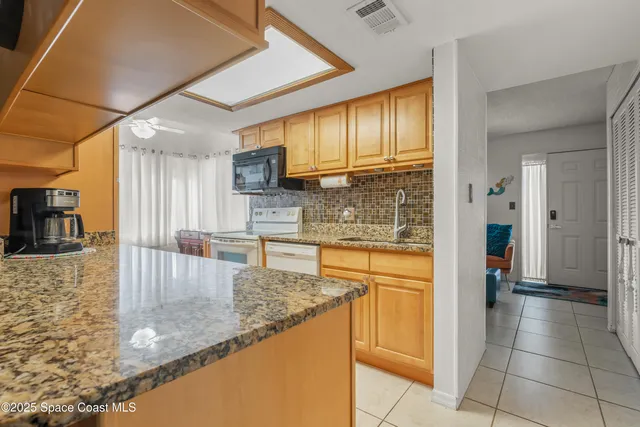 a view of a hallway with paintings on the wall