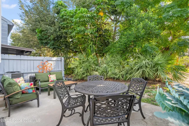 a bathroom with a toilet sink and shower curtain