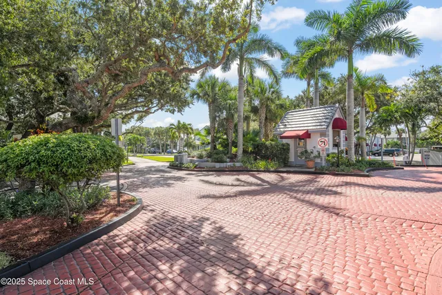 a view of a house with a swimming pool and a yard