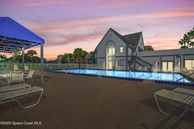 a view of a house with wooden floor and a lake view