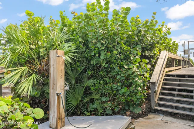 a view of a house with swimming pool and sitting area