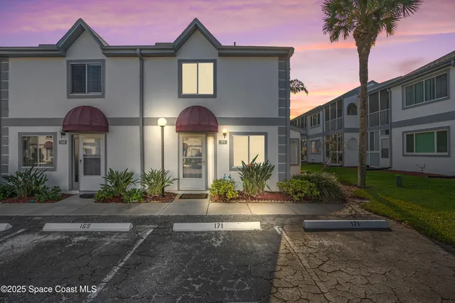 a living room with furniture a rug and a window