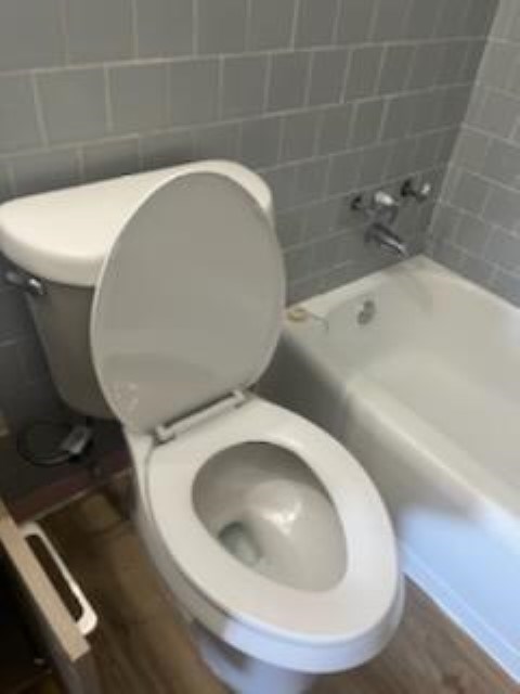 2336 Fort Benning Road, Unit 4 Columbus, GA 31903 - Photo 10 of 11 a bathroom with a toilet and bathtub