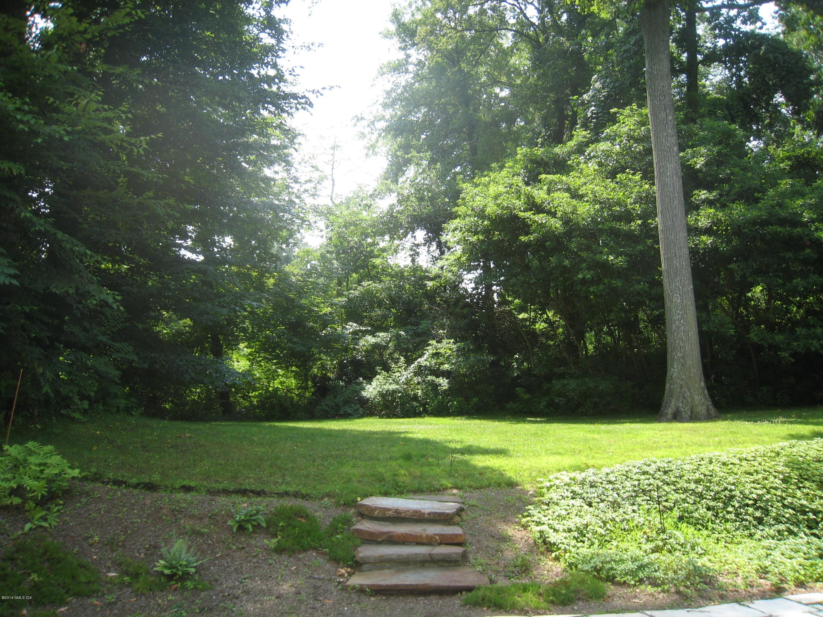 134 Butternut Hollow Road Greenwich, CT 06830 - Photo 12 of 15 a view of a golf course with a tree