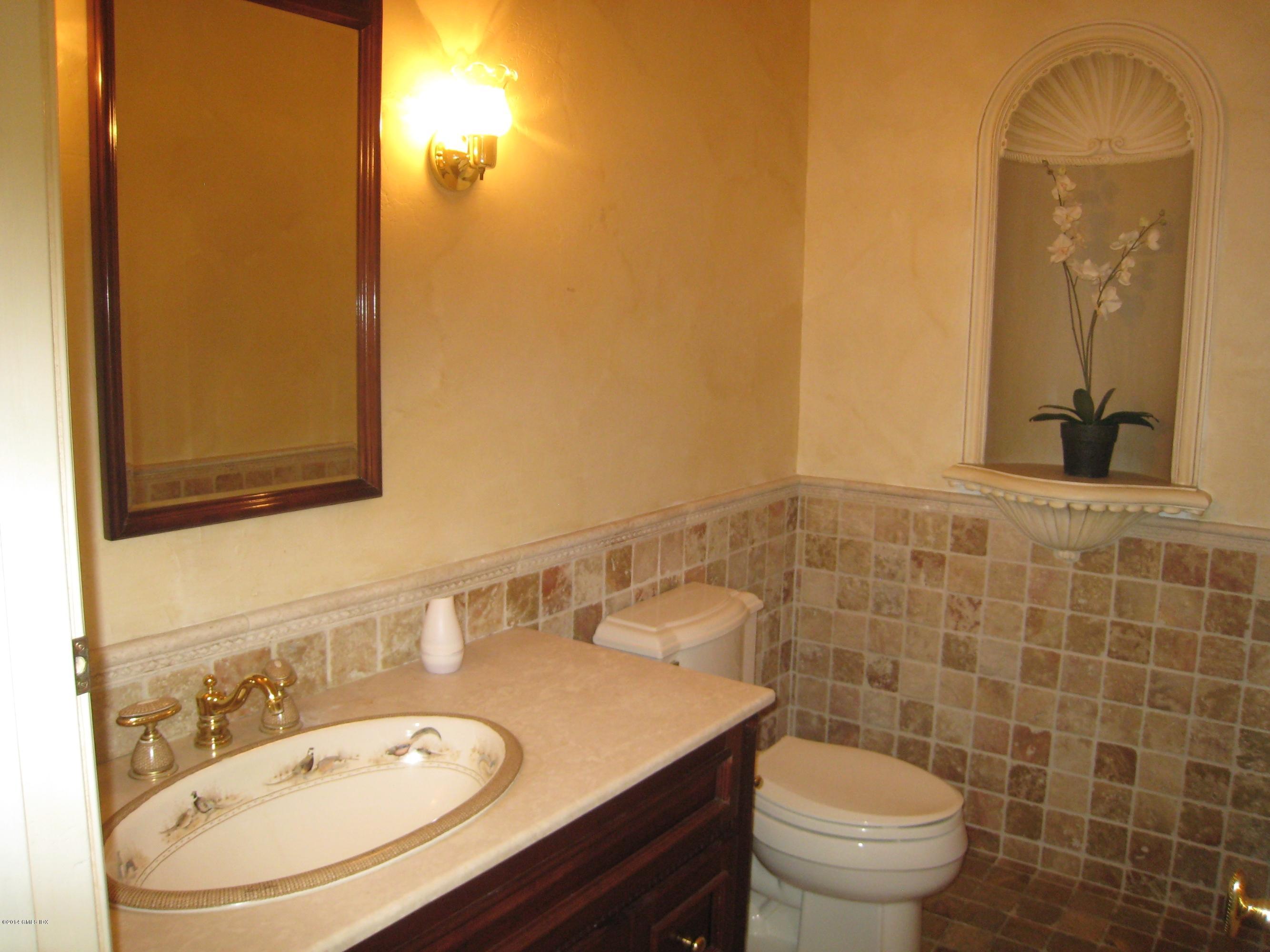 134 Butternut Hollow Road Greenwich, CT 06830 - Photo 8 of 15 a bathroom with a sink mirror vanity and toilet