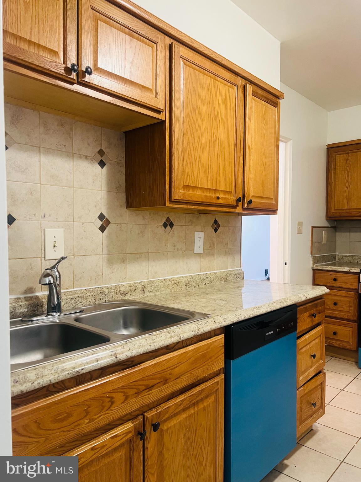 4901 Fitch Place Northeast Washington, DC 20019 - Photo 14 of 44 a kitchen with stainless steel appliances granite countertop a sink and cabinets