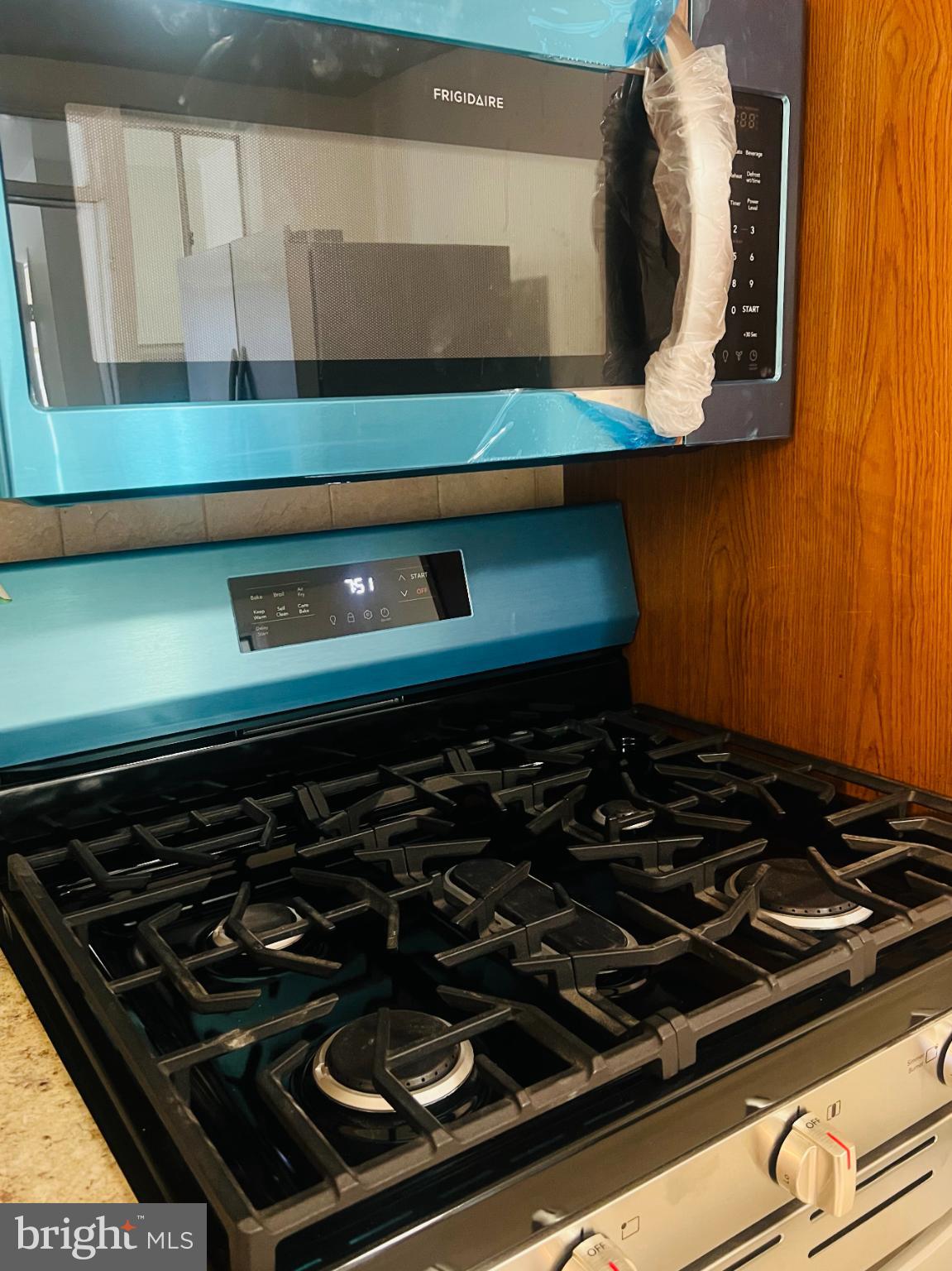 4901 Fitch Place Northeast Washington, DC 20019 - Photo 15 of 44 a close view of a stove a microwave and cabinets