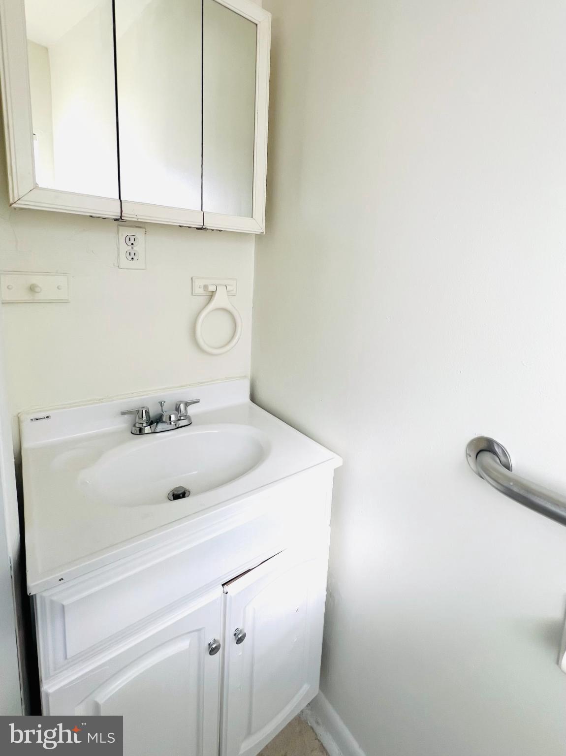 4901 Fitch Place Northeast Washington, DC 20019 - Photo 19 of 44 a bathroom with a sink and cabinets