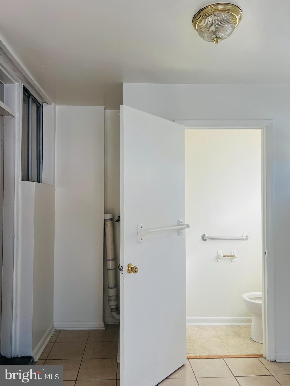 4901 Fitch Place Northeast Washington, DC 20019 - Photo 26 of 45 Bright and airy bathroom entrance.
