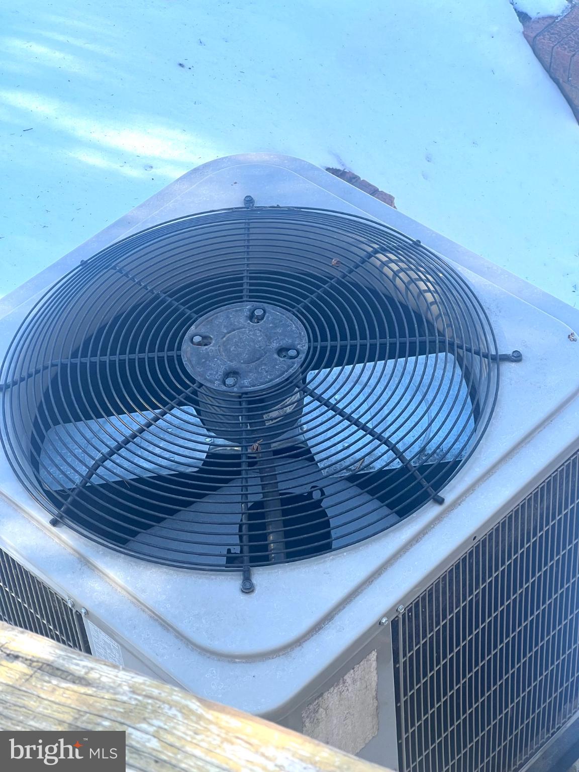 4901 Fitch Place Northeast Washington, DC 20019 - Photo 28 of 45 Cooling unit atop a snowy landscape.