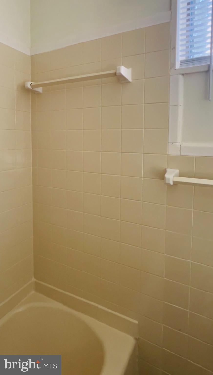 4901 Fitch Place Northeast Washington, DC 20019 - Photo 44 of 45 Bright and clean bathroom with tiled walls.