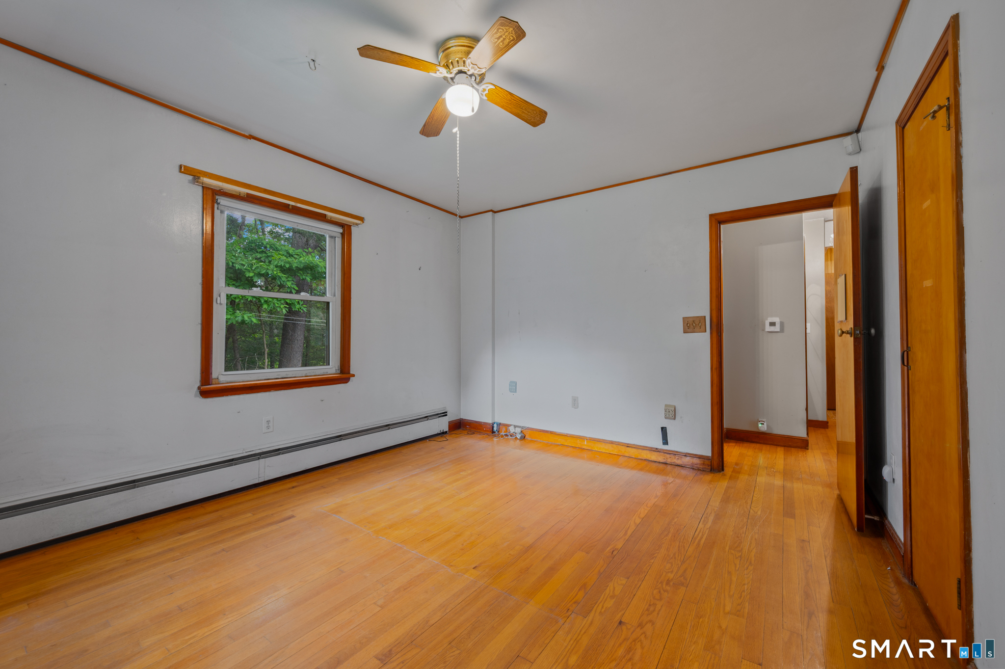 152 Ramstein Road New Hartford, CT 06057 - Photo 10 of 20 an empty room with a window and a ceiling fan