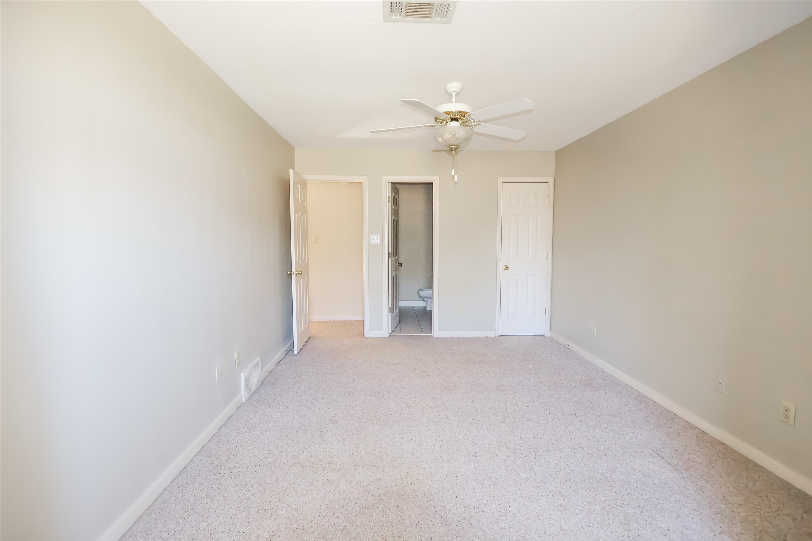 121 Reed Circle Drummonds, TN 38023 - Photo 26 of 38 Unfurnished bedroom featuring light colored carpet and ceiling fan