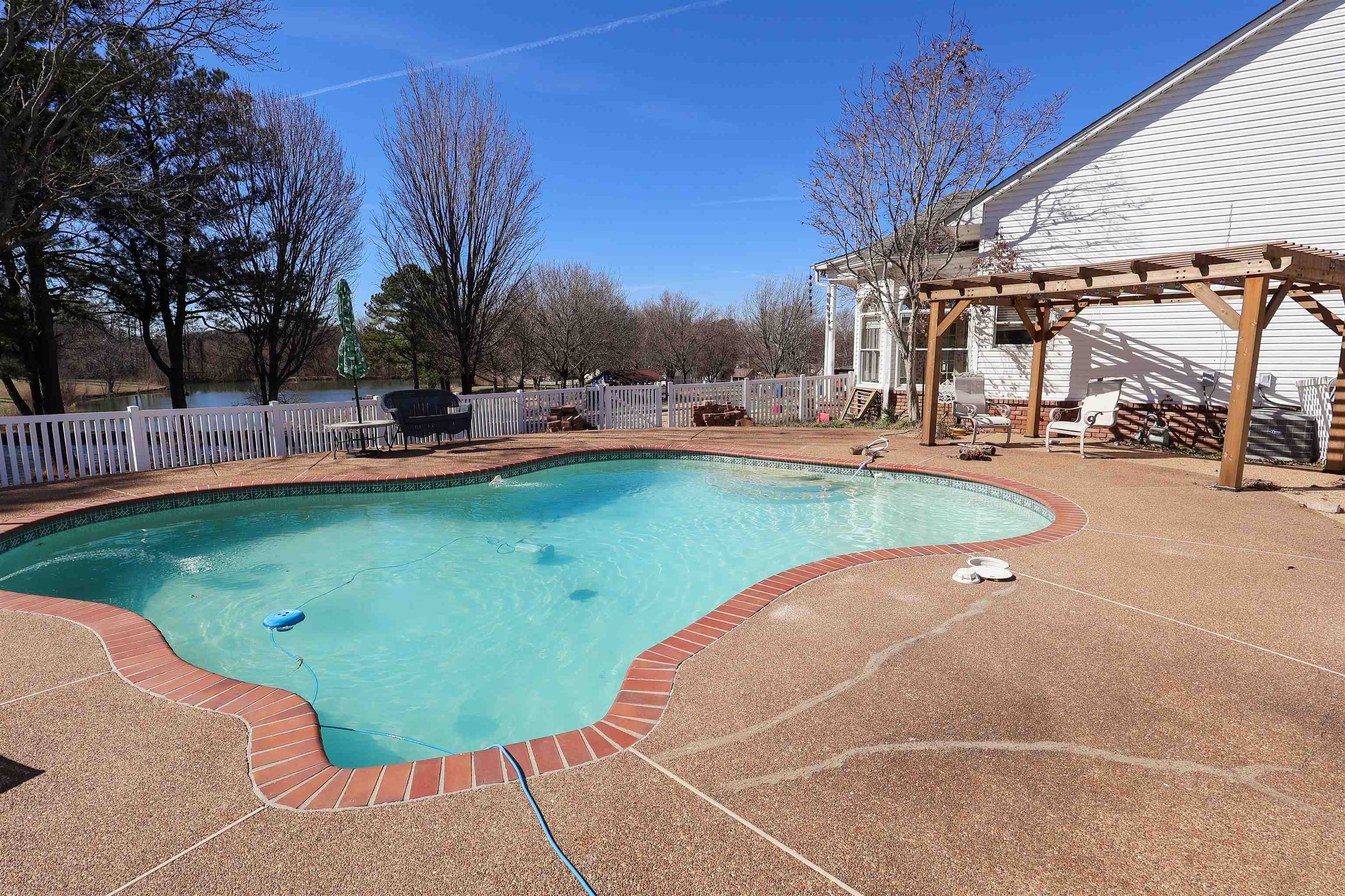 121 Reed Circle Drummonds, TN 38023 - Photo 38 of 38 View of pool featuring a patio area, a fenced backyard, a fenced in pool, and a pergola