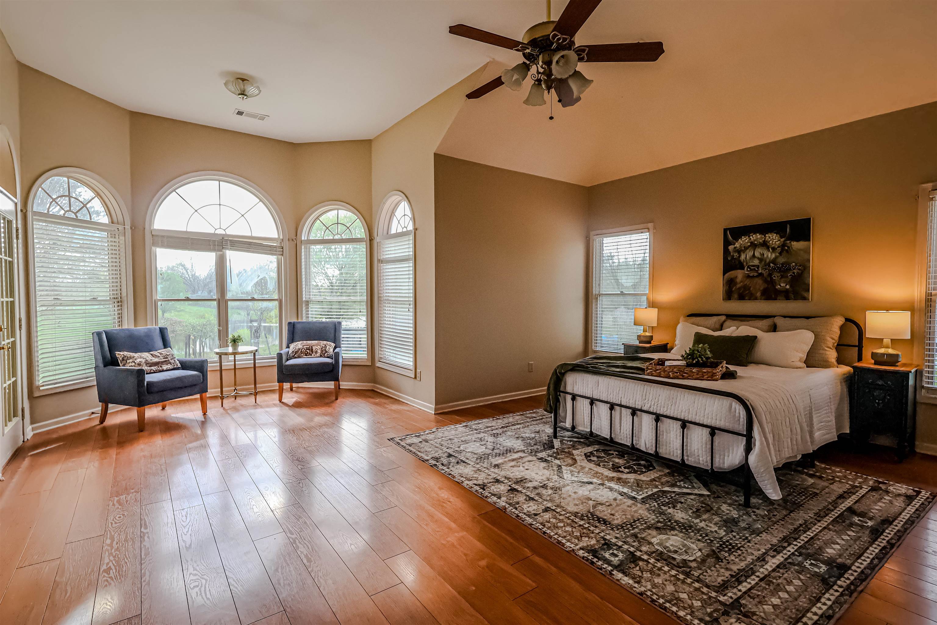121 Reed Circle Drummonds, TN 38023 - Photo 9 of 38 Bedroom featuring baseboards, lofted ceiling, ceiling fan, and wood finished floors