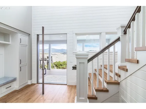 a view of entryway with wooden floor