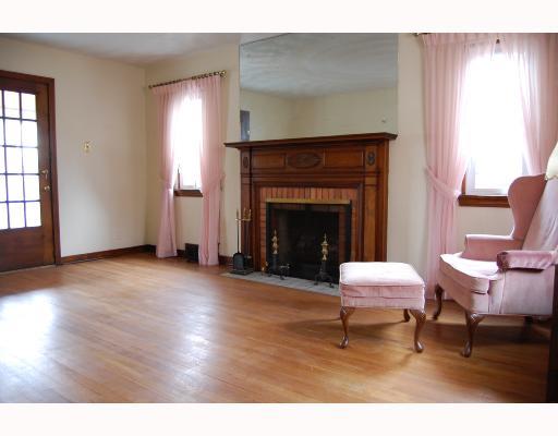 1323 Prospect Road Whitehall, PA 15227 - Photo 3 of 8 Living Room. Living room with hardwood floors and beautiful fireplace.