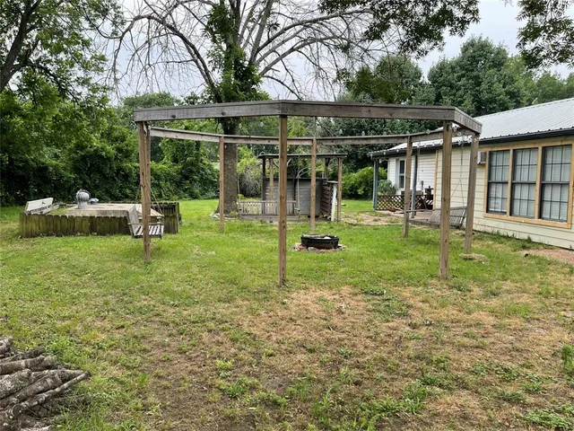 a view of a chair and table in the yard