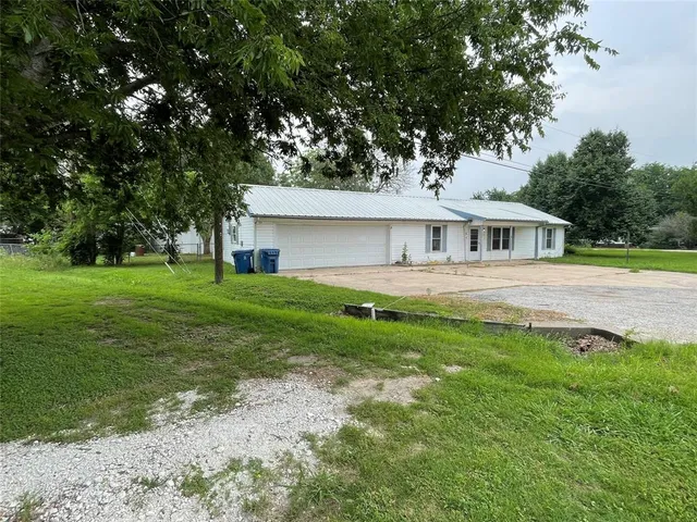 a house view with a garden space