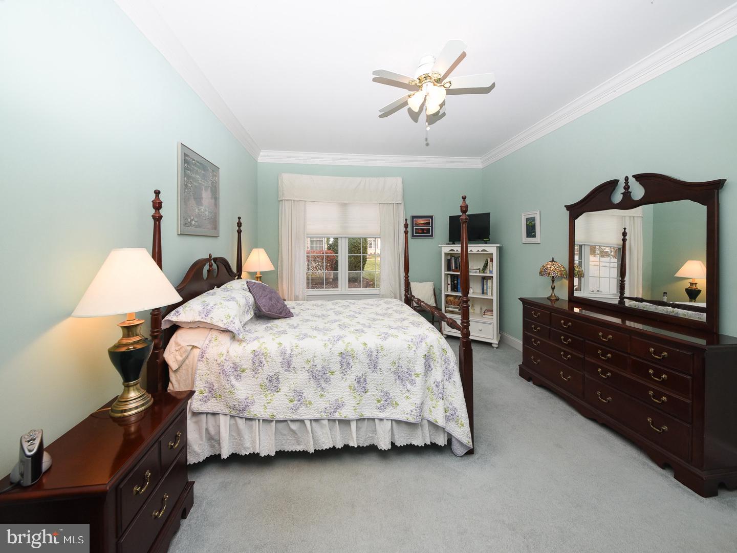 3113 Arborgreene Court Hatfield, PA 19440 - Photo 20 of 33 a bedroom with a bed and a flat tv screen on dresser
