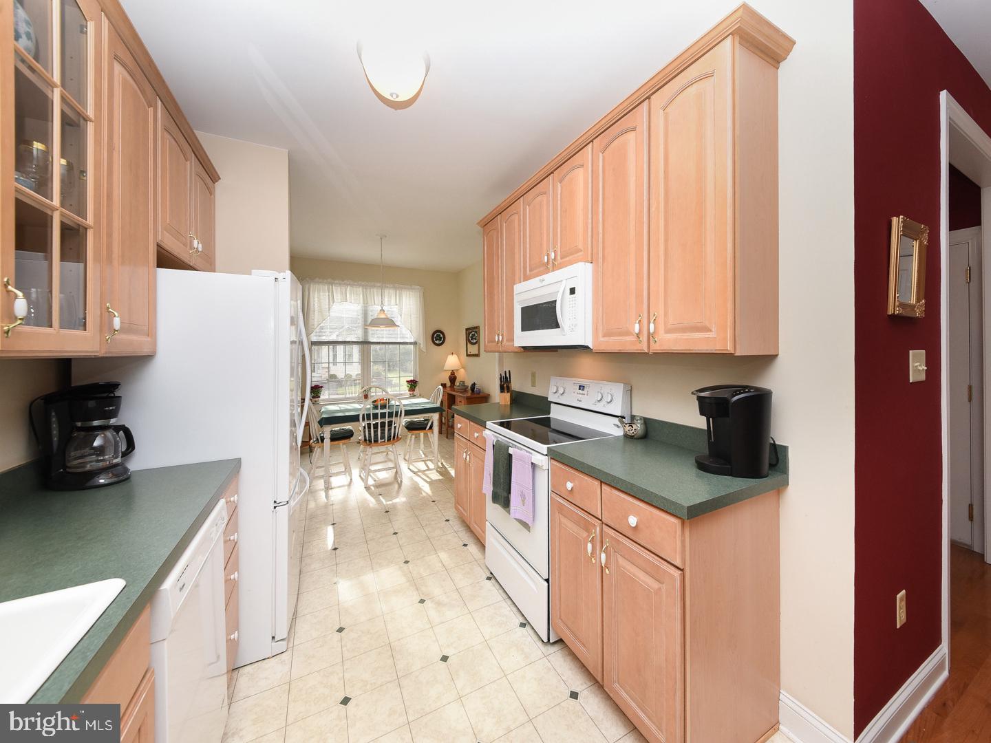 3113 Arborgreene Court Hatfield, PA 19440 - Photo 8 of 33 a kitchen with granite countertop a sink a counter top space appliances and cabinets
