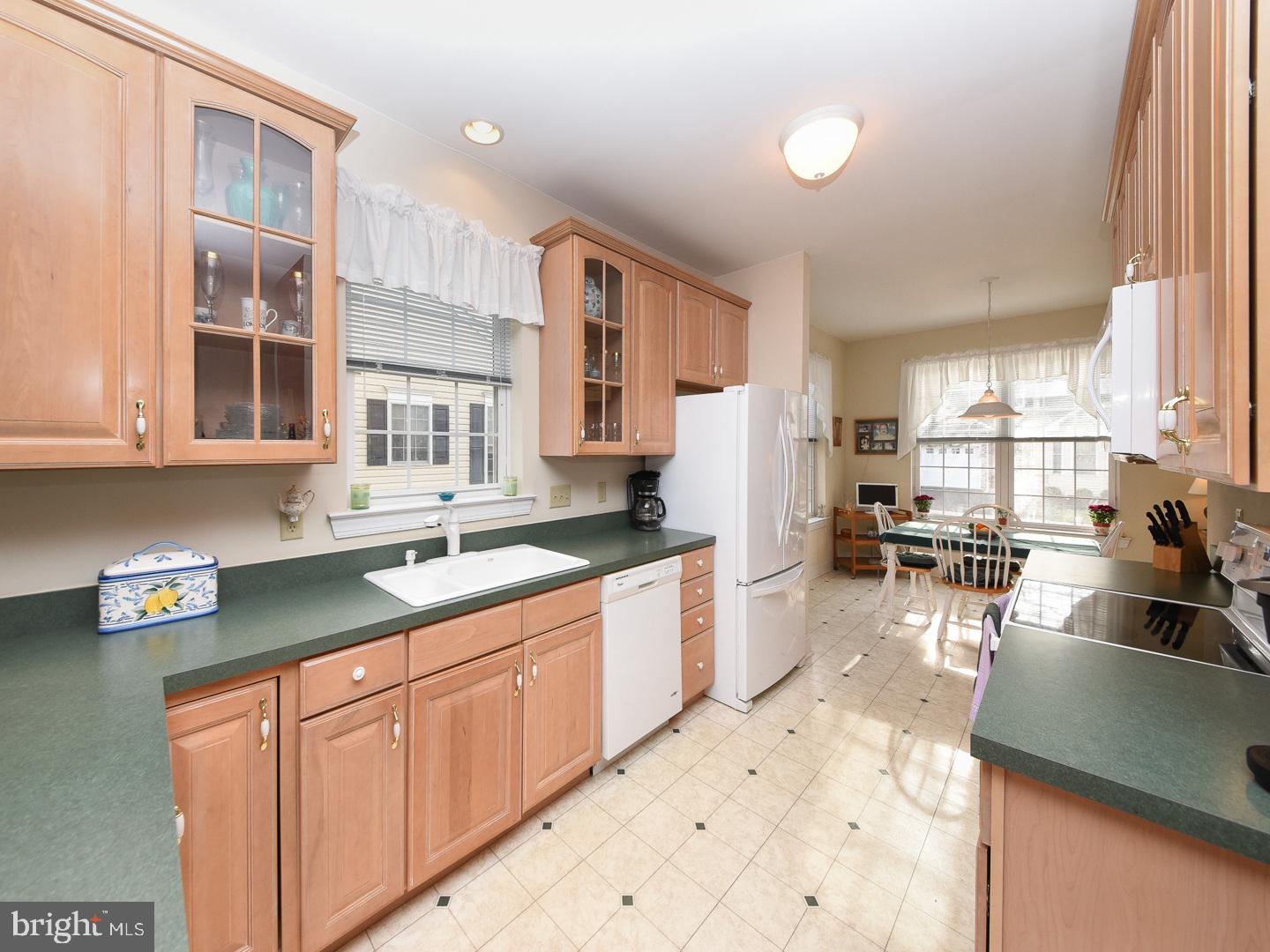 3113 Arborgreene Court Hatfield, PA 19440 - Photo 9 of 33 a kitchen with a sink stove and cabinets