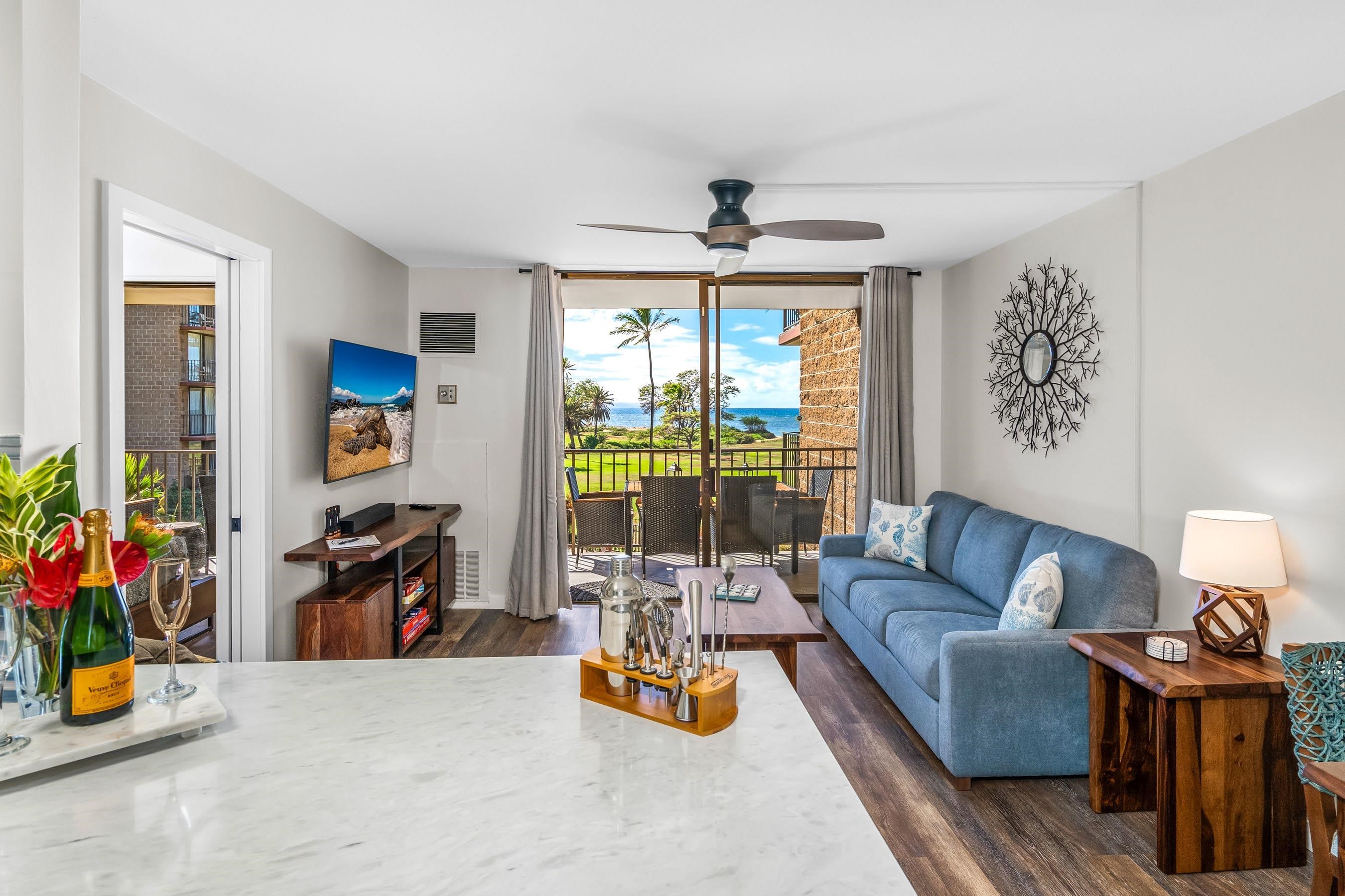 938 South Kihei Road, Unit 309 Kihei, HI 96753 - Photo 11 of 34 a living room with furniture and a large window