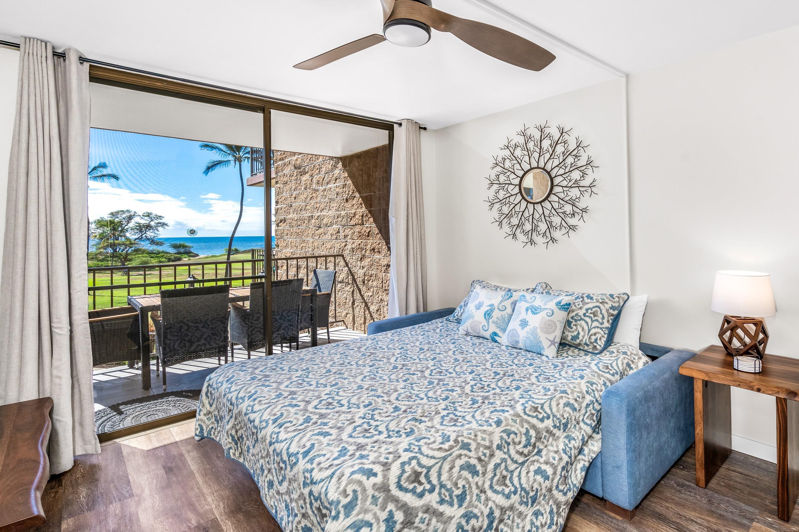 938 South Kihei Road, Unit 309 Kihei, HI 96753 - Photo 17 of 34 a bedroom with a large bed and a large window