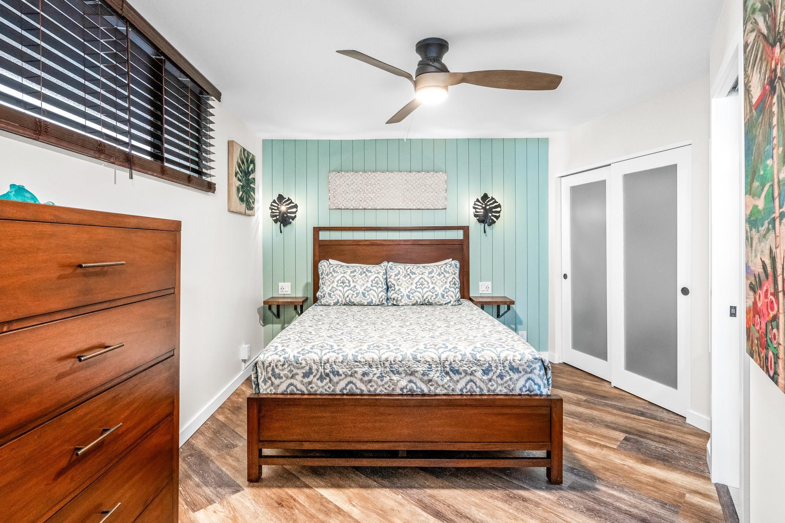 938 South Kihei Road, Unit 309 Kihei, HI 96753 - Photo 23 of 34 a bedroom with a bed and a mirror on the dresser