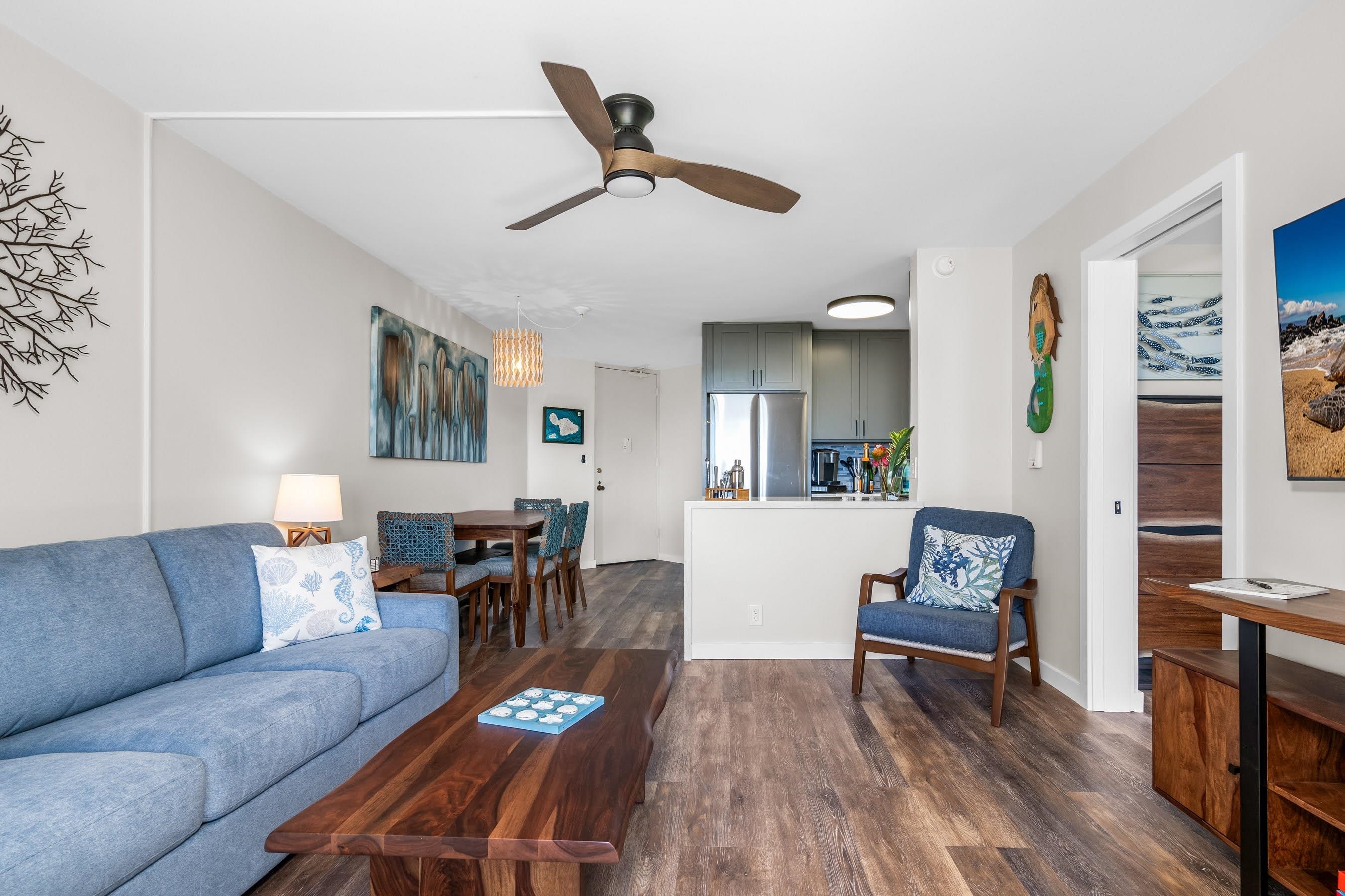 938 South Kihei Road, Unit 309 Kihei, HI 96753 - Photo 7 of 34 a living room with furniture and wooden floor