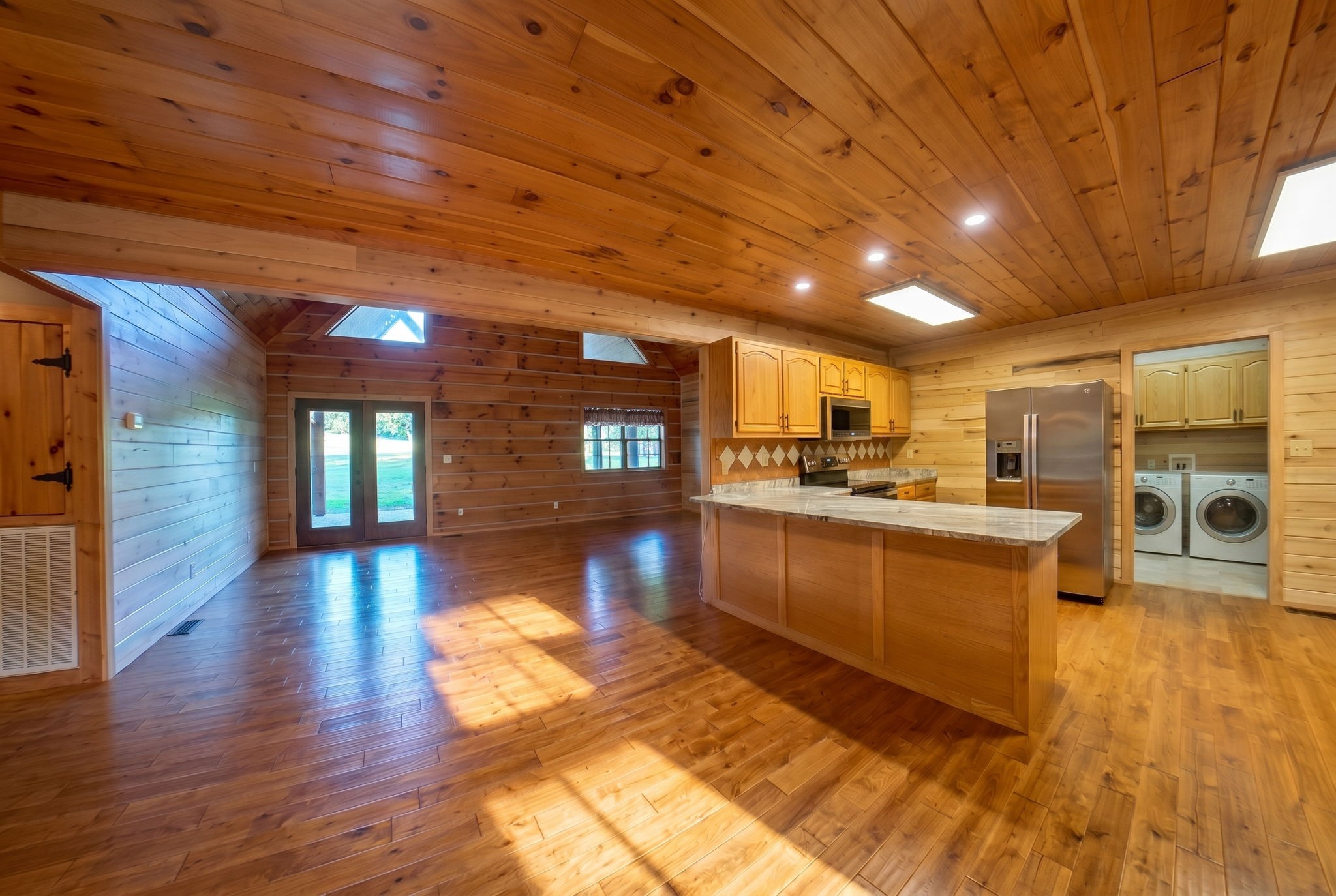 2909 B Beech Log Road Watertown, TN 37184 - Photo 7 of 67 a kitchen with stainless steel appliances granite countertop a stove and wooden floors